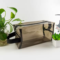 Pochette de voyage transparente en PVC imperméable personnalisée pour cosmétiques et maquillage avec fermeture éclair et poignée