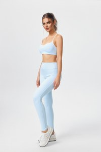 Sports bra and yoga pants set featuring a crisscross back; the pants lift the glutes and flatter the figure. - Product Image 4