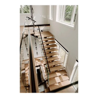 Escalier intérieur à monopoutre en acier avec marches en chêne pour l'intérieur