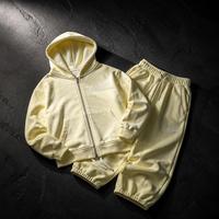 Conjunto de 2 piezas de ropa de descanso para hombre: Sudadera con capucha extragrande 100% algodón con cremallera completa y bolsillo canguro, y pantalones de chándal de pierna ancha con cintura acanalada y cordón.