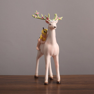 Adorno de resina de niño montando un ciervo de estilo nórdico para decoración de sala de estar y dormitorio - Product Image 2