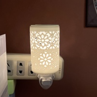 Diffuseur de cire électrique en céramique moderne, motif floral creux, prise américaine, lampe d'aromathérapie pour la maison, parfum d'ambiance et veilleuse