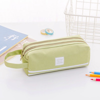 1 pièce/étui à crayons double couche de couleur unie, grande capacité, boîte à papeterie simple, sac à papeterie portable à double fermeture éclair