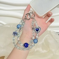Nueva funda para teléfono con correa de pulsera de lentejuelas metálicas con efecto de diamante y cadena colgante