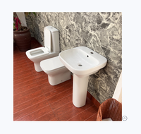 Lavabo rond en céramique blanche au design moderne et élégant avec piédestal pour appartements, facile à nettoyer