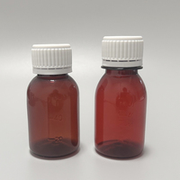 Bouteille vide de solution orale anti-vol rotative à pression transparente brune en PET de 60 ml avec étiquette privée personnalisée