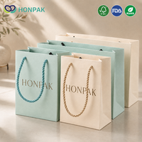 HONPAK Embalaje de joyería de boda de lujo Tamaño personalizado Bolsas de cartón de alta calidad con cinta Artículo promocional de bajo precio