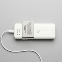Chargeur de voyage portable UniCell C, fonctionne parfaitement pour charger les piles AA NiMH ou Li-ion 14500