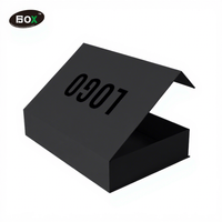 Boîte d'emballage cadeau en papier A4 noir magnétique pliable avec logo personnalisé, matériaux recyclés pour les sweats à capuche et les vêtements