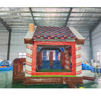 Château gonflable de Noël en forme de pain d'épices avec double toboggan et piscine à eau, combo gonflable pour la location d'événements en extérieur