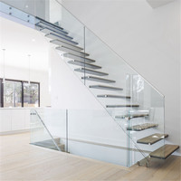 Escalier droit flottant moderne pour résidence avec poutre en acier inoxydable et marches en bois massif