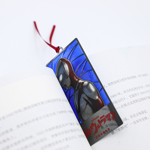 Marcapáginas de Latón con Vidrio Teñido Brillante y Logotipo Impreso de Planeta Cielo Azul para Amantes de la Lectura - Product Image 1