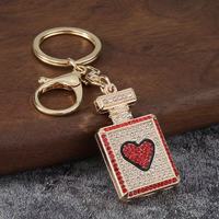 Porte-clés mousqueton en alliage léger et étanche, avec pendentif décoratif en forme de flacon de parfum orné de strass, pour femme, vente en gros, cadeau