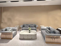 Elegante sofá curvo con diseño de muebles de cuero azul de alta calidad de 123 plazas con laca trasera beige Sofá modular de arte seccional