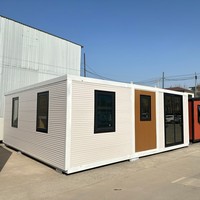 Maison de conteneur préfabriquée portable de 40 pieds avec conception de paquet plat extensible solaire pour magasin d'entrepôt et application de villa