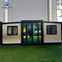 Maison conteneur modulaire préfabriquée moderne à double aile, avec auvent, fenêtre et porte vitrée, pour cabane de vacances à la plage ou au jardin, en acier extensible