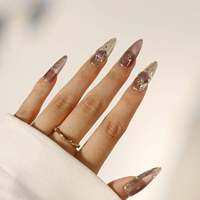 Faux ongles à presser en acrylique transparent rose nude effet œil de chat, forme amande, avec cadre doré transparent et strass ovales roses, 10 pièces pour rendez-vous