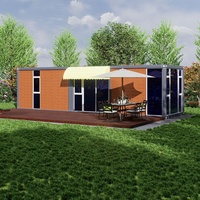 Maison conteneur préfabriquée en panneaux sandwich d'acier, démontable, en kit plat, villa modulaire préfabriquée, appartement de villégiature avec terrasse