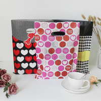 40*50cm Poignées découpées Porte-doigts Sacs cadeaux en plastique PE Sac à provisions pour vêtements Cosmétique Papeterie