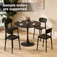 Table à manger ronde en bois noir de style minimaliste moderne, ensemble table et chaises inspiré d'Instagram, très populaire sur internet