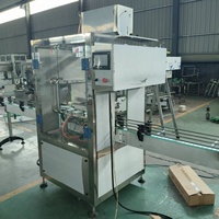 Machine de remplissage linéaire entièrement automatique à 2 têtes, à alimentation par gravité, pour liquides non visqueux et non gazeux