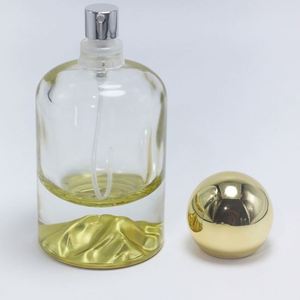 Bouteilles de parfum cylindriques en verre OEM/ODM 30ml 50ml 100ml avec fonds sérigraphiés or/argent/bleu/rouge/vert et pulvérisateur à pompe pour cadeau - Product Image 2