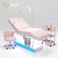 Nouveau design Mobilier de salon de beauté Base argentée Lit cosmétique de salon Table de massage moderne et luxueuse pour spa visage rose avec éclairage