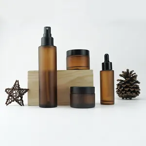 Amber Color Cylinder Pump Glass Bottles And Jars For Glass Cosmetic Packaging