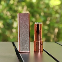 Étui à rouge à lèvres rectangulaire scintillant emblématique Or rose Emballage de luxe à paillettes 2026 Contenant cosmétique vide professionnel en gros LUMI