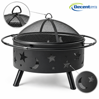 Brasero d'extérieur rond en fer noir pour bois, avec écran anti-étincelles en maille à découpes lune et étoile, sur trépied