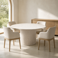 Table à manger ronde en pierre calcaire beige crème, table sur piétement en pierre naturelle avec base cannelée festonnée pour projet de villa moderne OEM