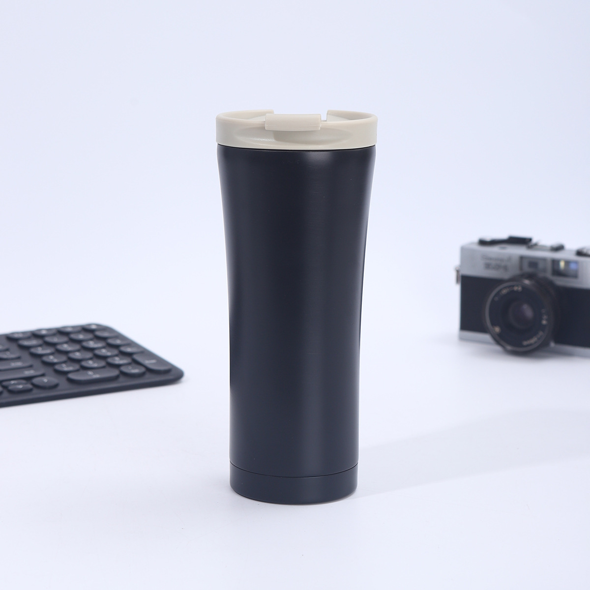 Black cup with white lid