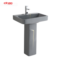 Ensemble de sanitaires en céramique gris pour salle de bain : lavabos sur pied et WC monobloc