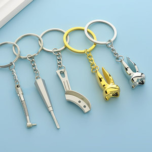 <span class=keywords><strong>Porte</strong></span>-clés dentaire en forme de dent molaire, <span class=keywords><strong>porte</strong></span>-clés en métal en forme de dents, outils dentaires métalliques simulés, forceps dentaires, <span class=keywords><strong>porte</strong></span>-clés de dentiste - Vente chaude - Product Image 1
