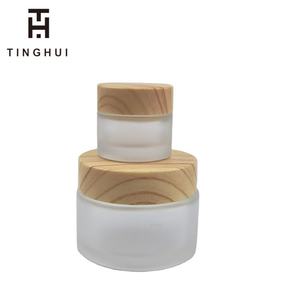 Custom Print logo 50g 100g 50ml 100ml Cosmetic Lotion Jar Frosted <b>Glass</b> Jars with Bamboo Wooden Lids - Product Image 1