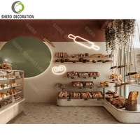Meubles de boulangerie haut de gamme, vitrine à pain en verre durable sur mesure, comptoir de boulangerie design pour l'aménagement intérieur d'une boulangerie.