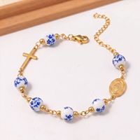 Bracelet chapelet en perles de porcelaine bleue et blanche avec croix en acier inoxydable, bijou religieux catholique vintage pour femmes