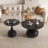 Table basse design en métal et pierre pour petit appartement, combinaison créative pour salon, table d'appoint noire haut de gamme pour canapé