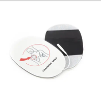 Coussinet TENS de type aiguille en queue de cochon en mousse équipement médical coussinet d'électrode de défibrillation de massage coussinet d'entraînement pour équipement AED adulte