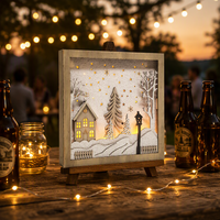 Cadre en bois N-Concept pour boîte à ombres de Noël avec lumière LED, scène de maison hivernale enneigée, décoration de Noël pour table