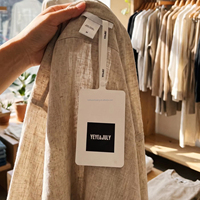 Étiquettes de vêtements personnalisées en papier couché imprimé avec sceau plastique inviolable à usage unique blanc pour l'emballage de vêtements et d'habillement