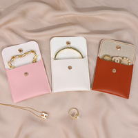 Nouveaux articles fermeture à pression bijoux organisateur sac anneaux boucles d'oreilles personnalisable Mini pochette en cuir PU parfait pour les petits accessoires