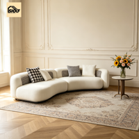 Ensemble de canapés modulaires ondulés et incurvés, revêtement en tissu avec structure en bois massif, conçu pour les salons contemporains