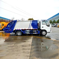 Camion compacteur de déchets ISUZU ELF KV100 personnalisé, 9 m³, 4x2, transmission manuelle, moteur diesel, avec pompe et moteur, à vendre