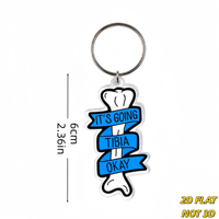 Porte-clés « It's Going Tibia Okay Bone » avec jeu de mots amusant sur l'anatomie et ruban bleu, breloque en acrylique découpée pour clés ou sac