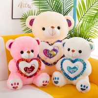Ourson en peluche musical lumineux LED qui brille dans le noir avec cœurs, rembourrage en coton PP, vente en gros pour la Saint-Valentin