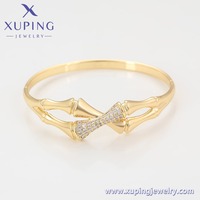 X000892620 XUPING Bracelet jonc articulé en alliage de cuivre plaqué or 14K avec micro-pavé de zircon, motif nœud de bambou, bijou élégant et tendance