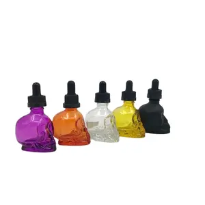 Botol minyak esensial kaca berbentuk tengkorak dicat 15ml 30ml, desain laris dengan penetes tahan anak