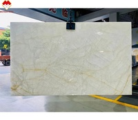 Panneau mural en pierre de quartzite onyx âge de glace translucide dalle de marbre onyx blanc rétro-éclairé pour une utilisation en intérieur comptoir d'îlot de sol Plus