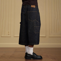 Shorts en jean YSJY OEM personnalisés style vintage Y2K avec surpiqûres contrastées, fermeture boutonnée, double genouillère et coupe large pour homme